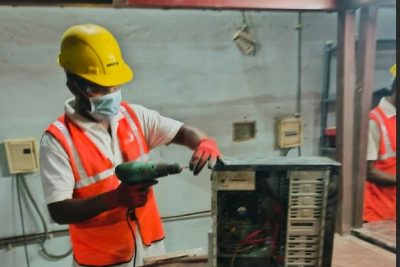 E-waste processing - Worker operating power tool